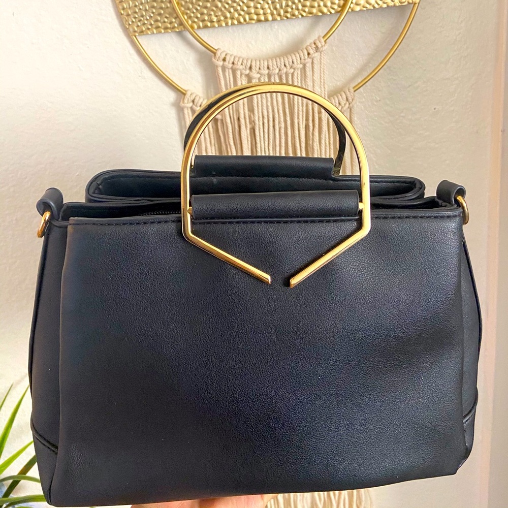 Black purse with gold details